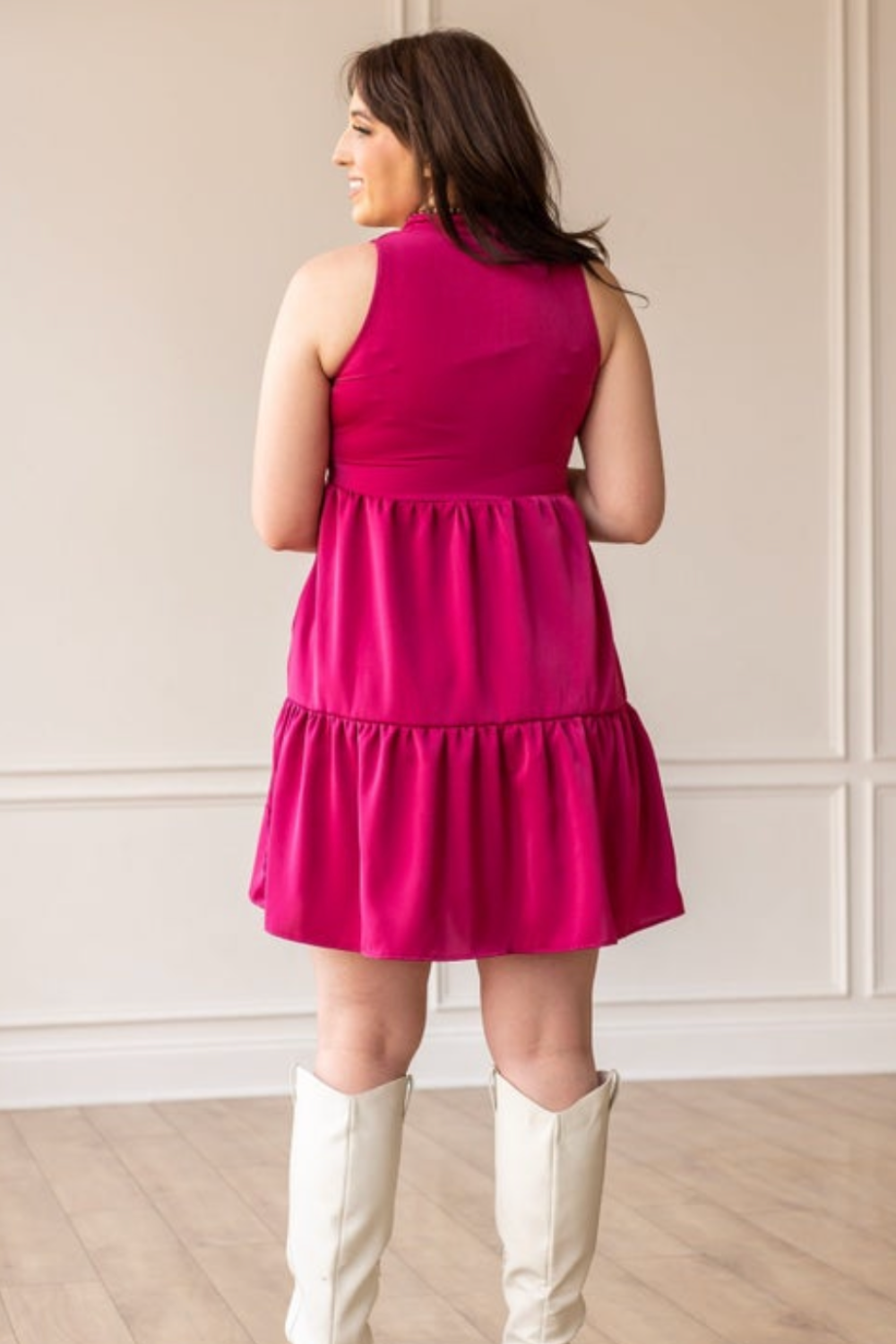 woman modeling magenta pink tank tiered dress with white cowboy boots