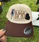 Beige and brown cap with 'Back on My Bullshit' text and lightning bolt design