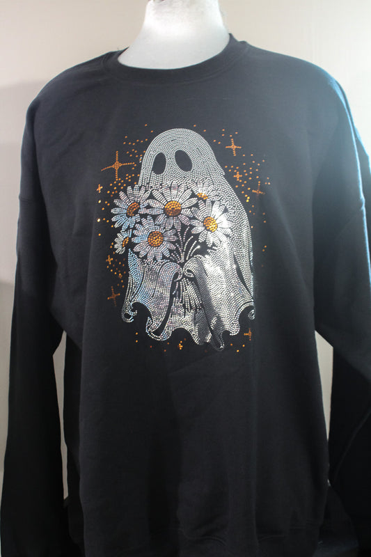 A black crewneck sweatshirt displayed on a mannequin torso, featuring a graphic print of a silver ghost holding white daisies with yellow centers, surrounded by small orange stars.